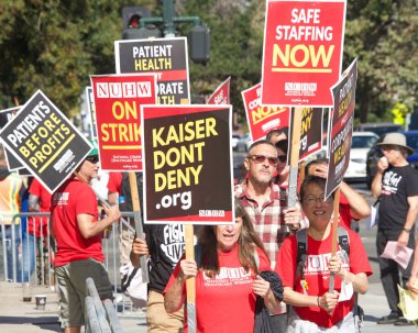 Oakland, CA - August 22, 2022:  Mental Health Care workers protesting outside Kaiser Medical Center on Broadway. Demanding Patient health be prioritized over corporate wealth. Patients before profits