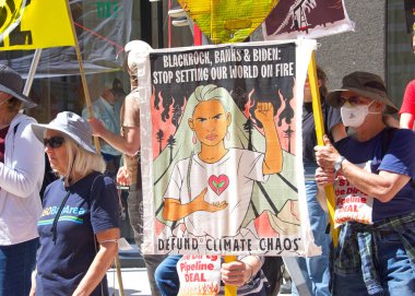San Francisco, CA - Sept 1, 2022: Unidentified protestors holding signs, protesting the dirty pipeline deal outside Senator Feinsteins office.