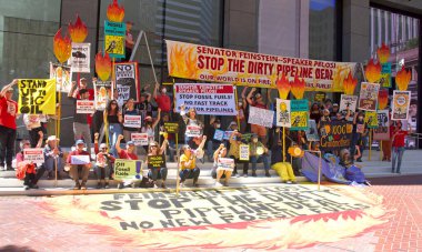 San Francisco, CA - Sept 1, 2022: Unidentified protestors protesting the dirty pipeline deal outside Senator Feinsteins office after painting a mural on the entry way
