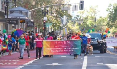 Oakland, CA - Sept 4, 2022:  Unidentified participants celebrate at the Oakland Gay Pride Parade on Broadway, downtown Oakland. Back to in person celebrations post covid pandemic restrictions.