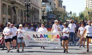 Oakland, CA - Sept 4, 2022:  Unidentified participants celebrate at the Oakland Gay Pride Parade on Broadway, downtown Oakland. Back to in person celebrations post covid pandemic restrictions.