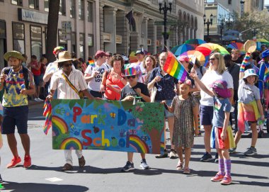Oakland, CA - Sept 4, 2022:  Unidentified participants celebrate at the Oakland Gay Pride Parade on Broadway, downtown Oakland. Back to in person celebrations post covid pandemic restrictions.