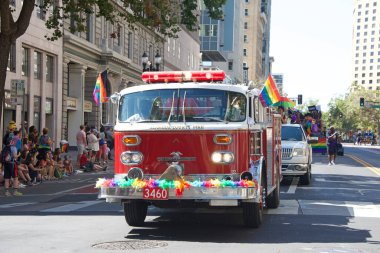 Oakland, CA - Sept 4, 2022:  Unidentified participants celebrate at the Oakland Gay Pride Parade on Broadway, downtown Oakland. Back to in person celebrations post covid pandemic restrictions.