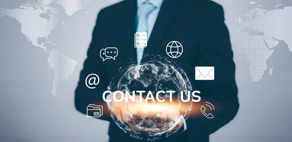 Concept communication and Contact us or Customer support hotline people connect. Business hand touching on virtual screen contact icons, email and address, live chat with internet wifi.