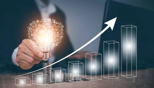 Creativity in the hands of business people idea concept,Businessman holding glowing light bulb with arrow business and connection line, creative thinking ideas and innovation technology and creativity
