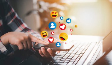 Hand holding smartphone and touch Social media and digital online concept, smart phone with Social media, concept of living on vacation and playing social media. Social Distancing