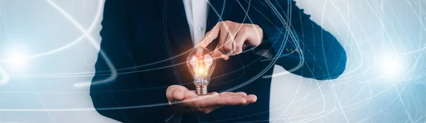 Creativity in the hands of business people idea concept, Businessman holding glowing light bulb with drawing brain and connection line, creative thinking ideas and innovation technology and creativity