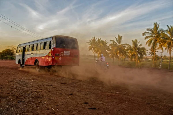 2010 Selective Focus Local Bus Driving Fast Dust Cloud Road — 스톡 사진