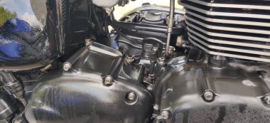 Motorcycle oil leaks from the engine compartment.