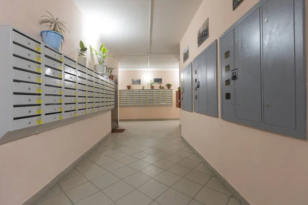 mailboxes in the lobby of an apartment building