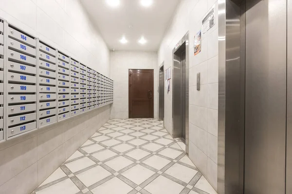 mailboxes in the lobby of an apartment building