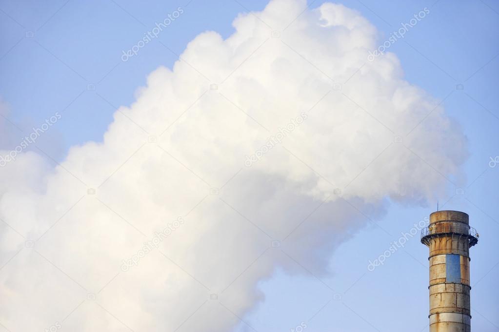 Industrial chimney with huge cloud of smoke