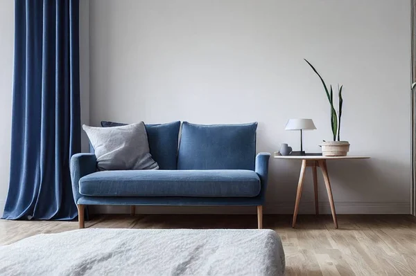 Minimalist interior of bedroom, cabinet or living room. Gray modern armchair with blue pillow and soft blanket, on table pot with plant, home design with light wall in scandinavian style, panorama