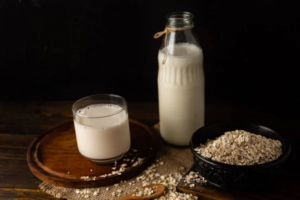 One Bowl Oatmeal Next Bottle Milk Glass Chopped Sight — Stockfoto