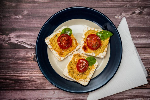 Three Rice Crackers Chickpea Hummus Cherry Tomato Fresh Basil Plate — Foto de Stock