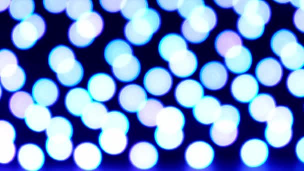 Rozostřená pulzující barevná světla bokeh na tmavém pozadí. Abstraktní pozadí dovolené bokeh. Prezentační party Bokeh Effect. Změna barev — Stock video