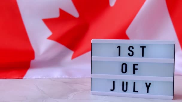 4k Bendera Nasional Kanada. Lightbox dengan teks Canadian 1ST of JULY Flag or the Maple Leaf. Patriotisme. Konsep hubungan internasional. Hari Kemerdekaan — Stok Video