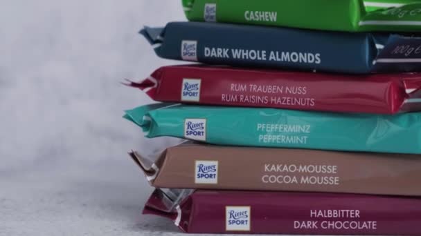 Kiev Ukraine - October 2021 Square chocolate Bar made by Alfred Ritter GmbH Co. chocolate Ritter Sport bars. German chocolate, different tastes. Copy space — Stock Video