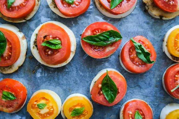 Big red tomatoes with green basil leaves and mozzarella cheese preparing for baking. Healthy homemade food. Cooking — Stock Photo, Image
