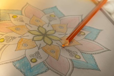 Mandalas antistress page to combat stress. Relaxing hobby mental wellbeing and art therapy. Meditative process of coloring pages. Self expression by art 