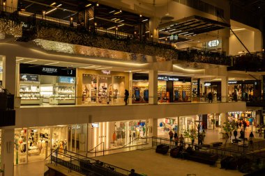 Gdansk Poland - April 2022. Forum gallery shopping mall view of the interior of the building at night. Modern shopping and entertainment centre. Architecture in the city center of Gdansk is the