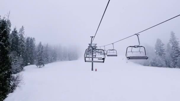 Pov Empty Ski Lift Snowy Mountain Winter Forest Chair Lift — Stock Video