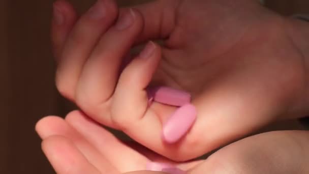 Female Hand Holding Pink Pill Collagen Supplement Nutrition Healthy Eating — Wideo stockowe