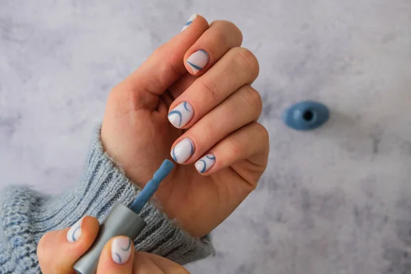 Professional stylish trendy blue Hardware Manicure. Procedure for the preparation of nails. Top view flat lay. Do manicure by yourself staying at home. Self care. Spa, beautician advertisement.