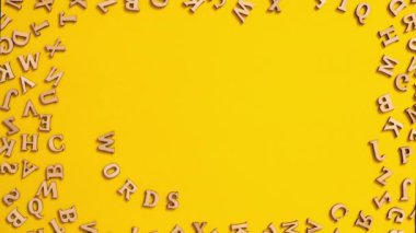 Time lapse of Quote WORDS HAVE POWER made out of wooden letters on bright yellow background. Motivational Words Quotes Concept. Text letters stop motion 4k footage 