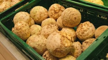4k The root of the celery in the store on the shelves of the market. Dietary products Seasonal vegetables for sale on the market. Healthy foods Vitamin containing products vegetarianism