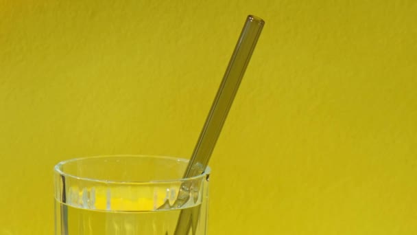 Reusable Glass Straws Glass Water Yellow Background Eco Friendly Drinking — Stock Video