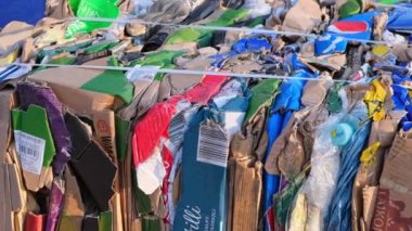 Gdansk Poland May 2022 blocks of waste paper on conveyor belt transported from shop. Paper waste landfill. pressed waste paper and cardboard recycling. Ecological factory for the processing of