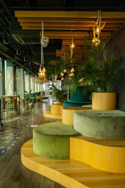 Gdansk Poland May 2022. Stylish restaurant interior for dinner and rest with great cocktails on roof top. Elegant and modern restaurant with wooden and ceramic floors. Interior design restaurant