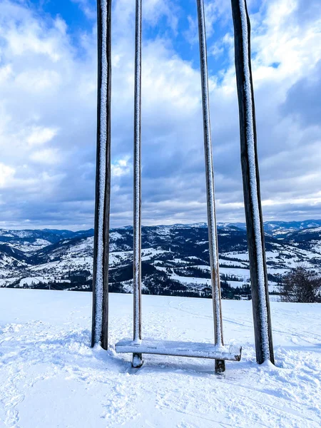 Ski swing snowy mountain winter forest with chair lift At The Ski Resort in winter. Snowy weather Ski holidays Winter sport and outdoor activities Outdoor tourism skiing snowboarding