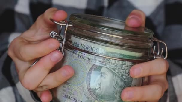 Polish Zloty Banknote Saving Money Glass Jar Unrecognizable Woman Moderate — Vídeo de stock