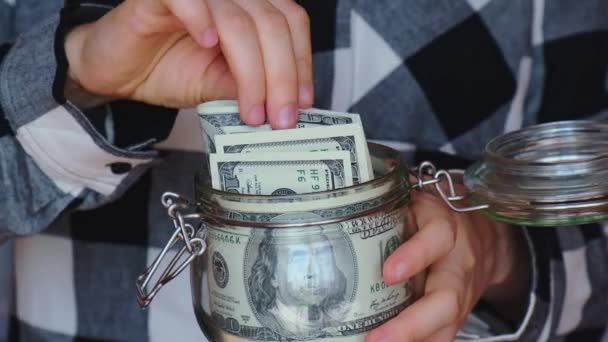 Dollar Banknote Saving Money Glass Jar Unrecognizable Woman Moderate Consumption — Vídeos de Stock