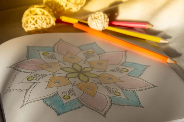 Coloring antistress page. Painting mandala to combat stress. Relaxing hobby mental wellbeing and art therapy. Sketch, meditative process of coloring pages. Self expression by art