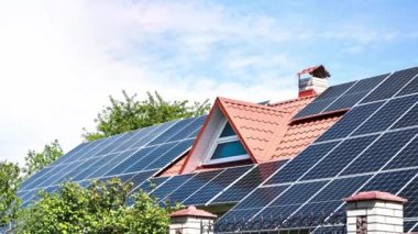 4k zoom in out New ecologic house with solar panels Alternative to conventional energy. The battery is charged from a solar cell Advertisement Green energy Sustainable life Renewable