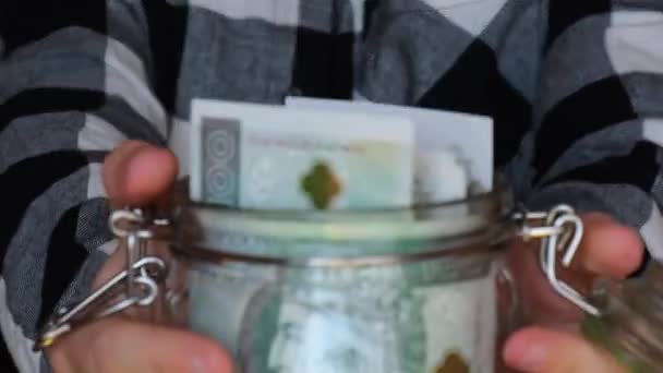 Polish Zloty Banknote Saving Money Glass Jar Unrecognizable Woman Moderate — Vídeo de stock