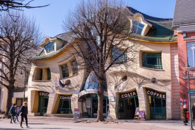 SOPOT POLAND - May 2022 Crooked house on the main Monte Cassino street in Sopot, Poland. Crooked little house Polish: Krzywy Domek is an unusually shaped building. Irregularly-shaped, one of fifty