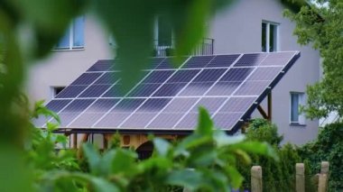 New ecologic house with solar panels Alternative to conventional energy. The battery is charged from a solar cell Advertisement Green energy Sustainable life Renewable alternative energy 