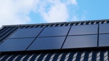 New ecologic house with solar panels Alternative to conventional energy. The battery is charged from a solar cell Advertisement Green energy Sustainable life Renewable alternative energy 