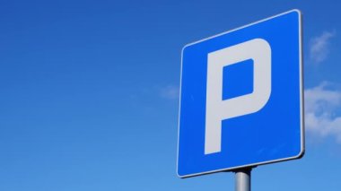 Parking sign showing free places. Traffic parking sign with clean sky and light ray. Cars became biggest problem for urban ecology due emission Outdoors