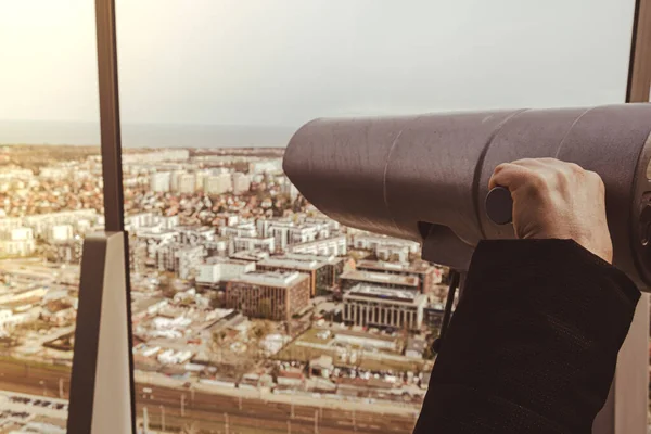 Using tourist binoculars look the sea horizon old city from the roof top in Gdansk. Oliva star business district Transport city traffic. Trams buses cars City Traffic Jam City life