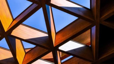 4k zoom in out Roofing Construction. Wooden Roof Frame House Construction. Abstract Structure background. Wood texture pattern. Architecture minimal concept. Visual art. Conceptual