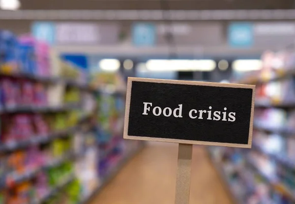 Wooden Information Label Sign Text Food Crisis Defocused Store Shelves — Foto Stock