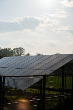 New ecologic house with solar panels Alternative to conventional energy. The battery is charged from a solar cell Advertisement Green energy Sustainable life Renewable alternative energy 