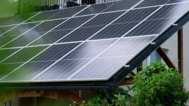 New ecologic house with solar panels Alternative to conventional energy. The battery is charged from a solar cell Advertisement Green energy Sustainable life Renewable alternative energy 