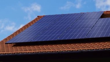 New ecologic house with solar panels Alternative to conventional energy. The battery is charged from a solar cell Advertisement Green energy Sustainable life Renewable alternative energy 