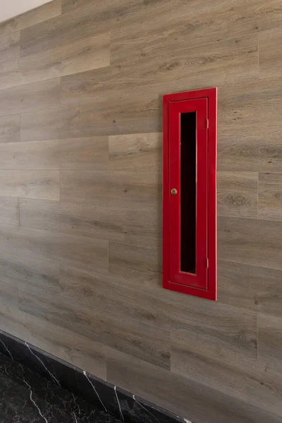 Hydrant or fire outlet in building corridor on a brown marble wall — Foto de Stock